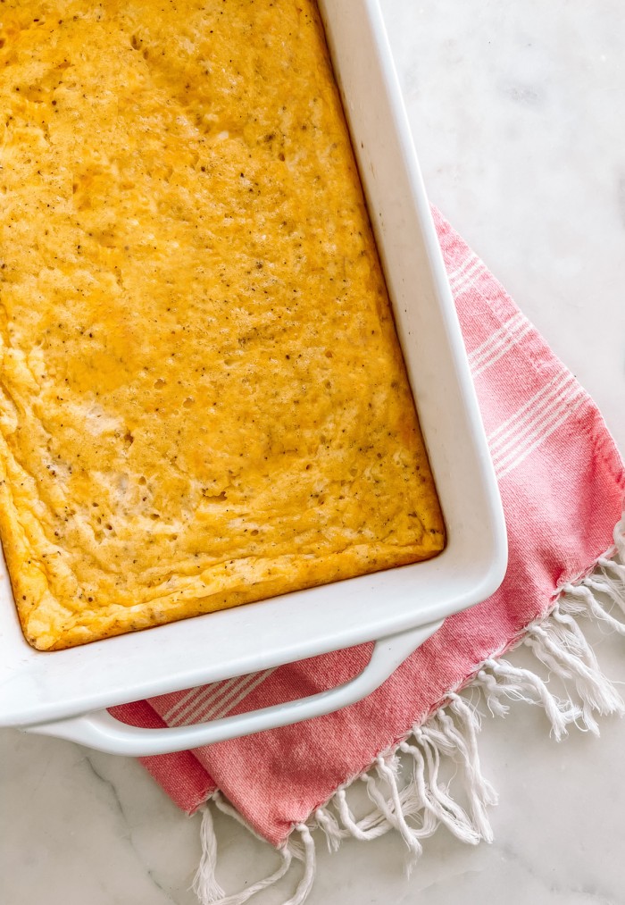Cheddar egg bake sitting on towel on table