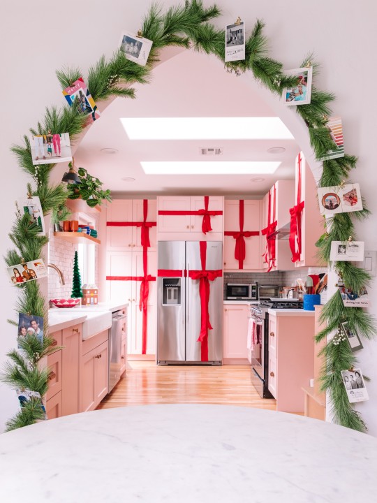 Christmas cards on garland around arch