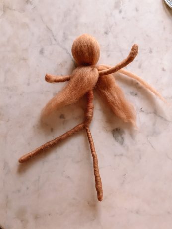 A doll made with yarn