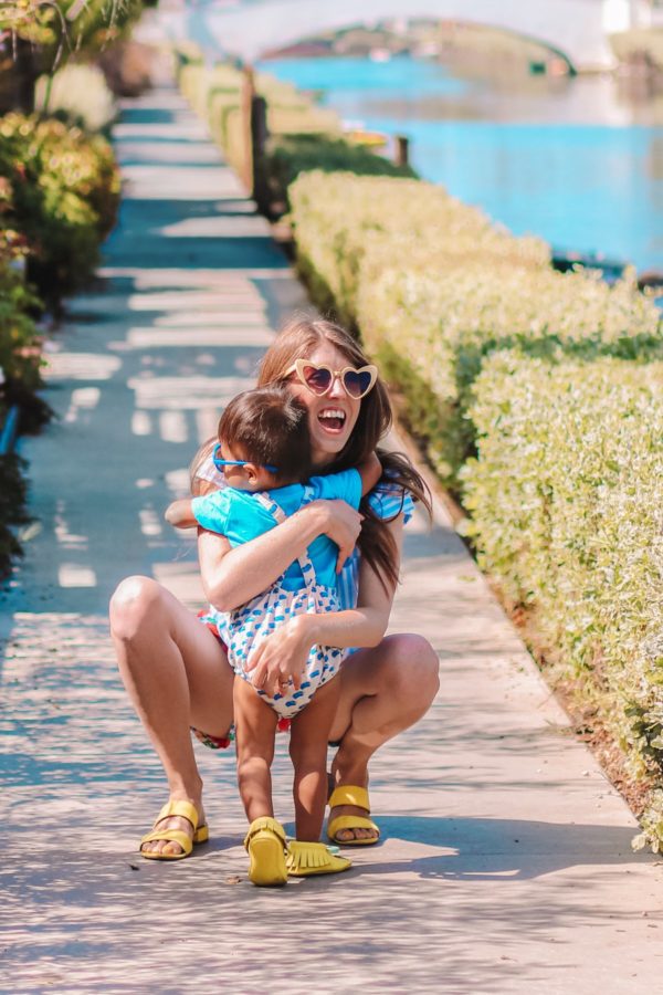 A woman holding a little boy