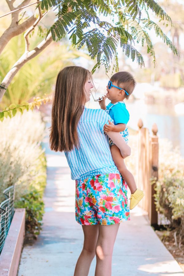 A woman holding a little boy