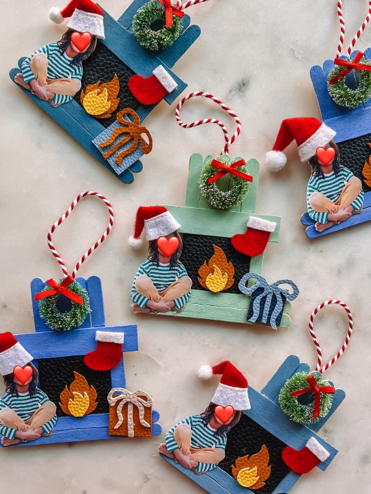 popsicle stick fireplace ornaments on marble table
